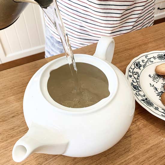 Pre-warming a teapot with hot water