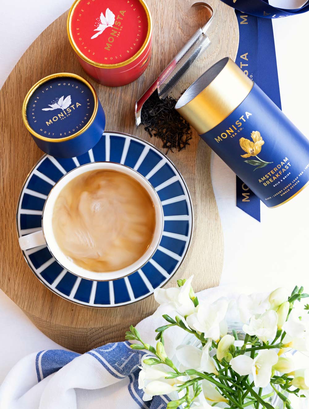 Tea cup with canisters and milky tea
