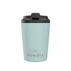 Pink insulated cup with a black lid and 'Monista Tea Co.' flower logo on a white background