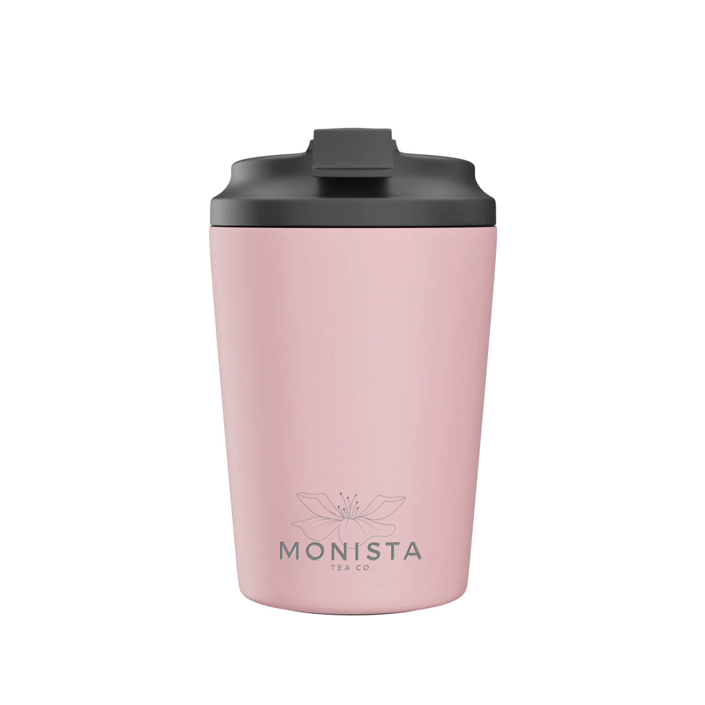 Pink insulated cup beside its pink 'Floss' Bino Cup packaging on a white background