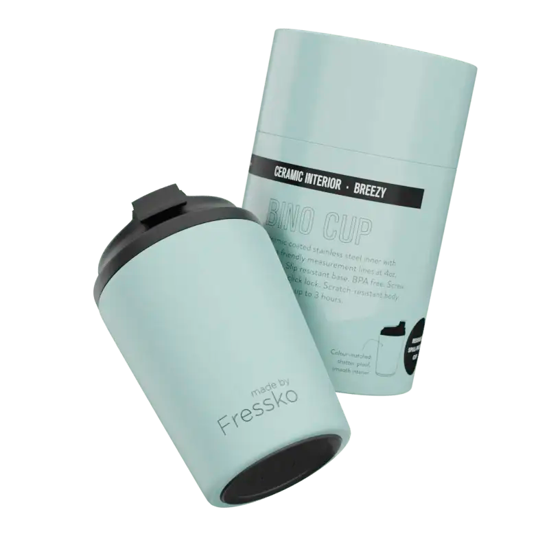 Mint green insulated cup beside its 'Breezy' Bino Cup packaging on a white background