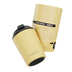 Yellow ceramic cup with black lid and 'Fressko' branding on a white background