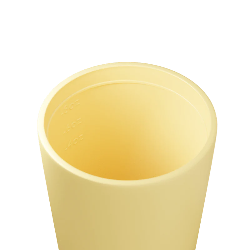Yellow cup on a white background