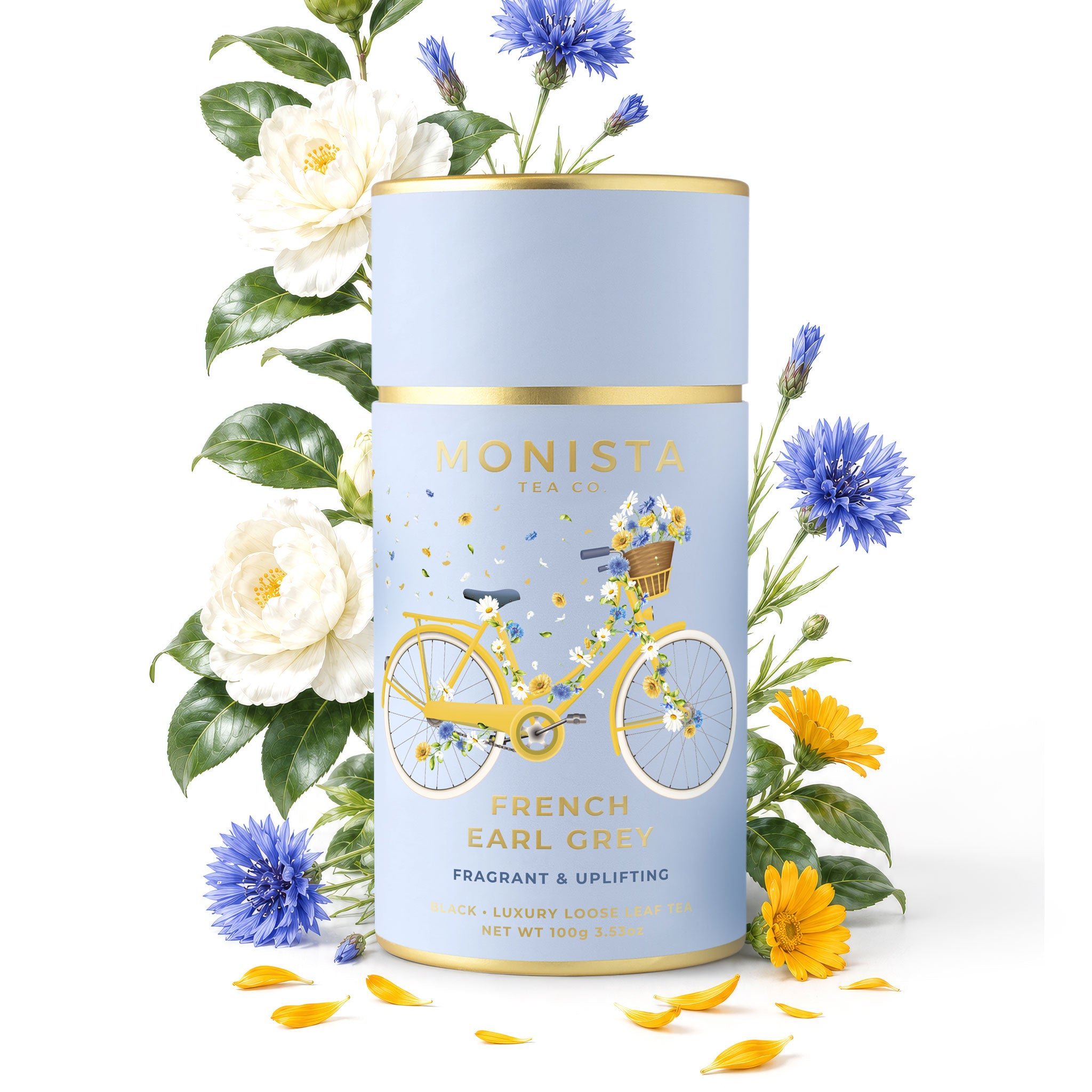 Monista tea canister with floral design and tea leaves on a white background