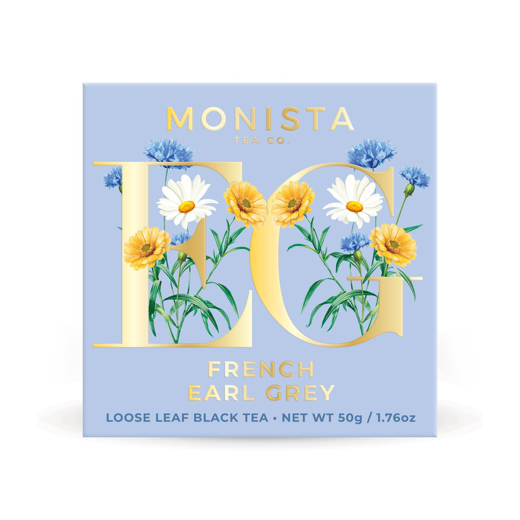 Monista Tea Co. French Earl Grey tea packaging with floral design on a light blue background