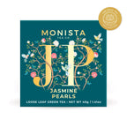 Monista Tea Co. Jasmine Pearls tea packaging with floral design and gold logo.