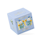Light blue French Earl Grey tea box with a gold floral monogram design shown at an angle