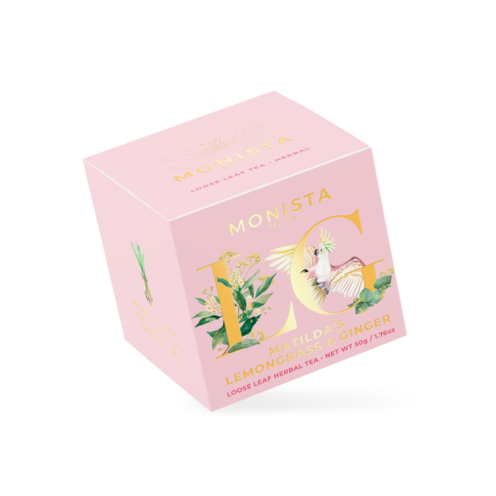 Pink Matilda's Lemongrass & Ginger tea box with a gold cockatoo monogram design shown at an angle