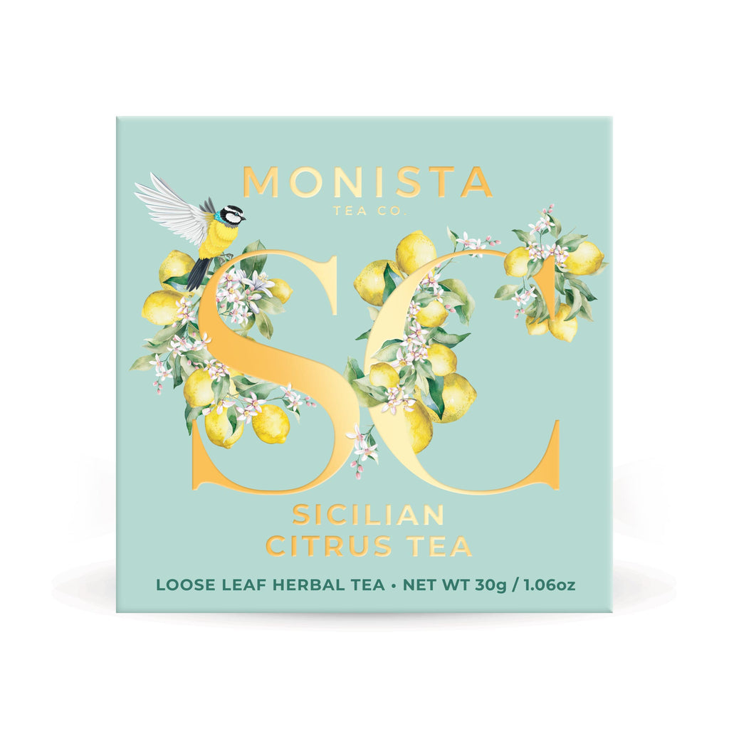 Mint green Sicilian Citrus tea box with a gold bird monogram design on a white background