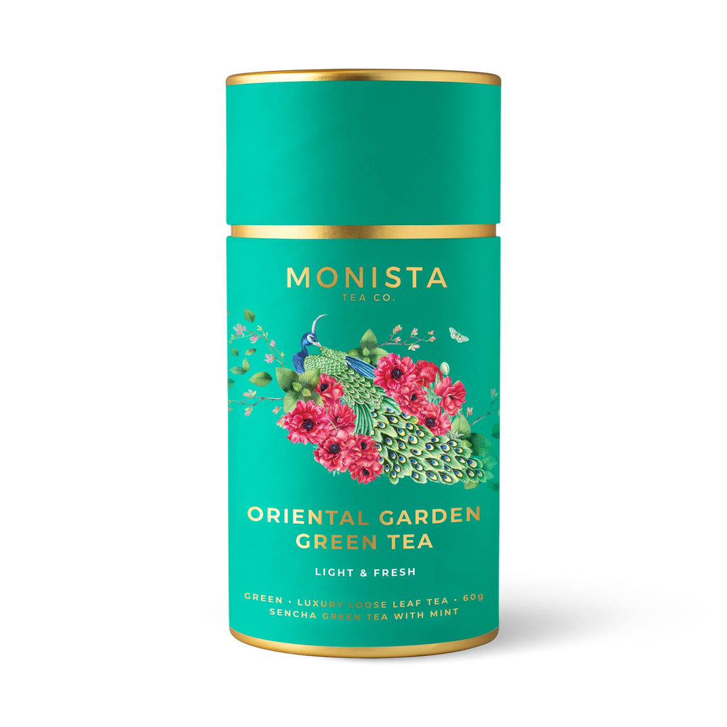 Teal tea canister with a peacock and poppy flower design and 'Oriental Garden Green Tea' branding on a white background