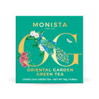 Monista Tea Co. Oriental Garden Green Tea packaging with peacock illustration on a green background