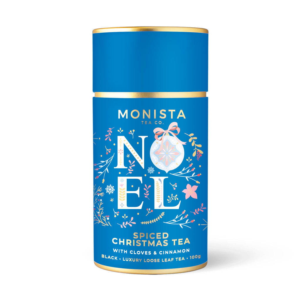 Blue tea canister with 'Monista Tea Co' branding and festive design on a white background