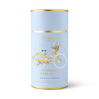 Light blue tea canister with a floral bicycle illustration and 'French Earl Grey' branding on a white background