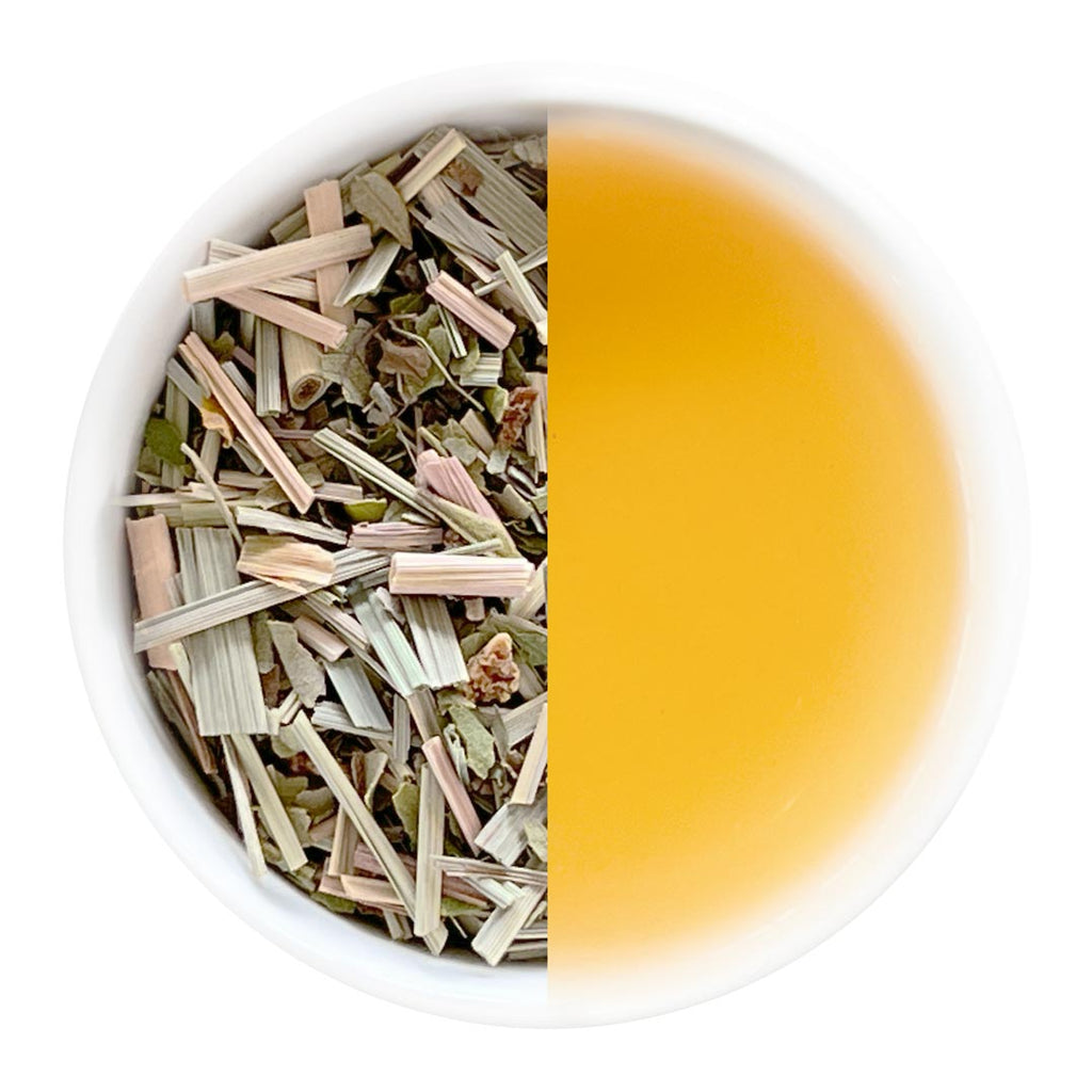 Tea leaves on the left and brewed tea on the right in a white cup.