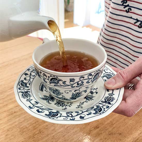 Pour tea into teacup