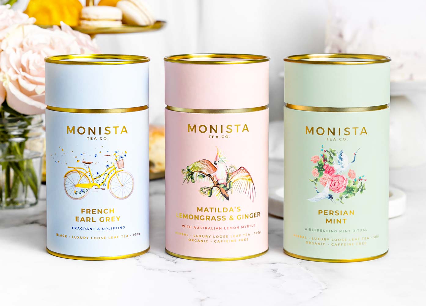 Monista tea canisters in blue, pink and green