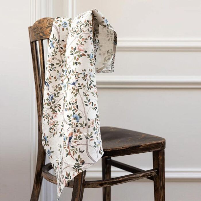 pretty floral tea towel draped over chair