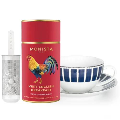 Red Tea canister with blue tea cup and infuser