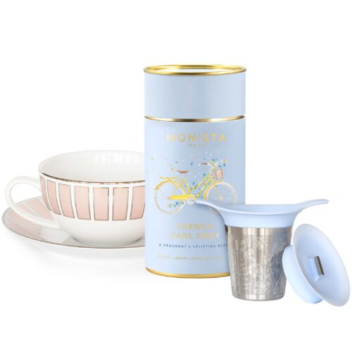 french earl grey tea with cup and saucer and infuser