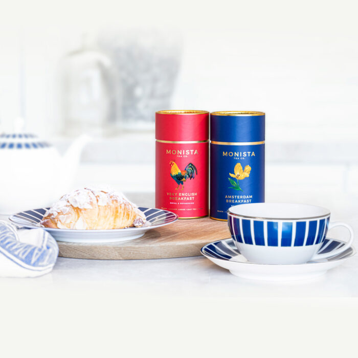 Tea canisters with cup and croissant