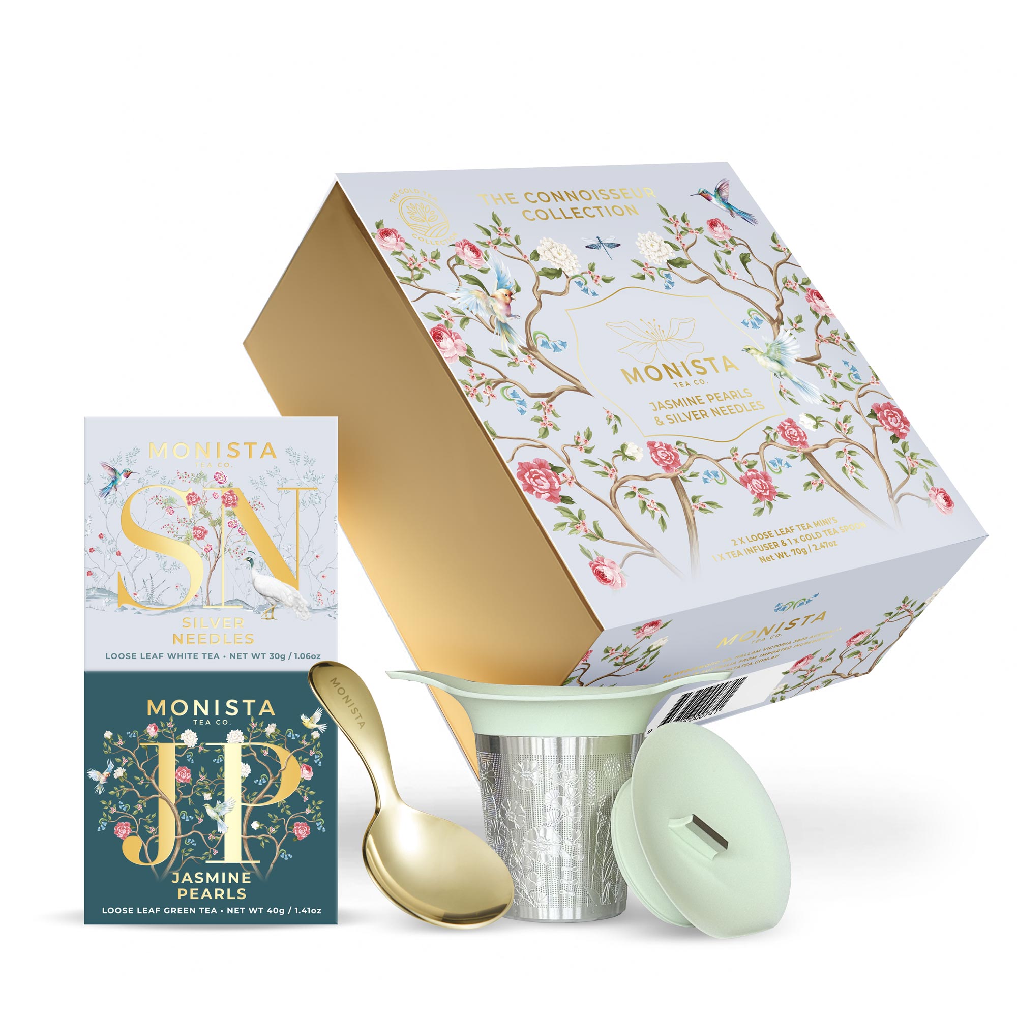 Gift box with two tea boxes basket infuser and a gold spoon