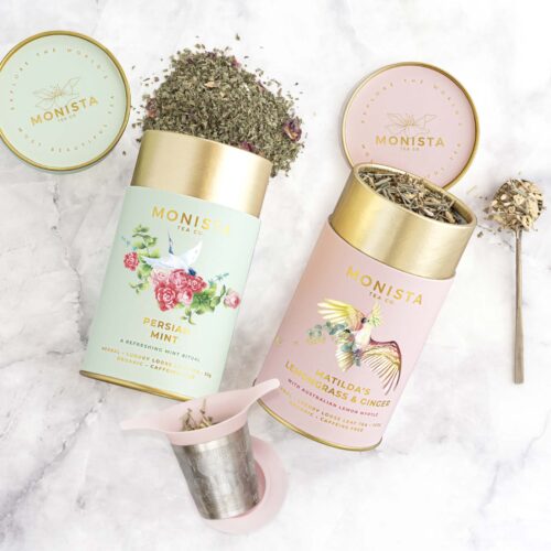 two tea canisters and infuser gift set