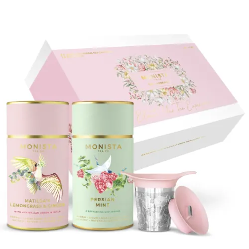 two tea canisters with tea infuser in front of gift box