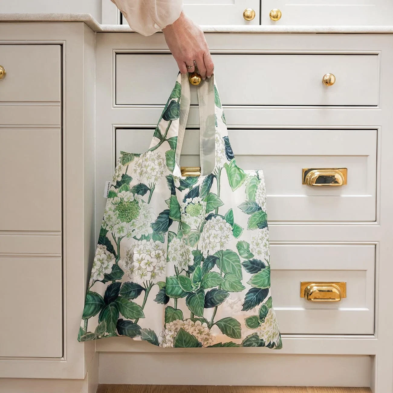 reusable shopping bag hanging in kitchen
