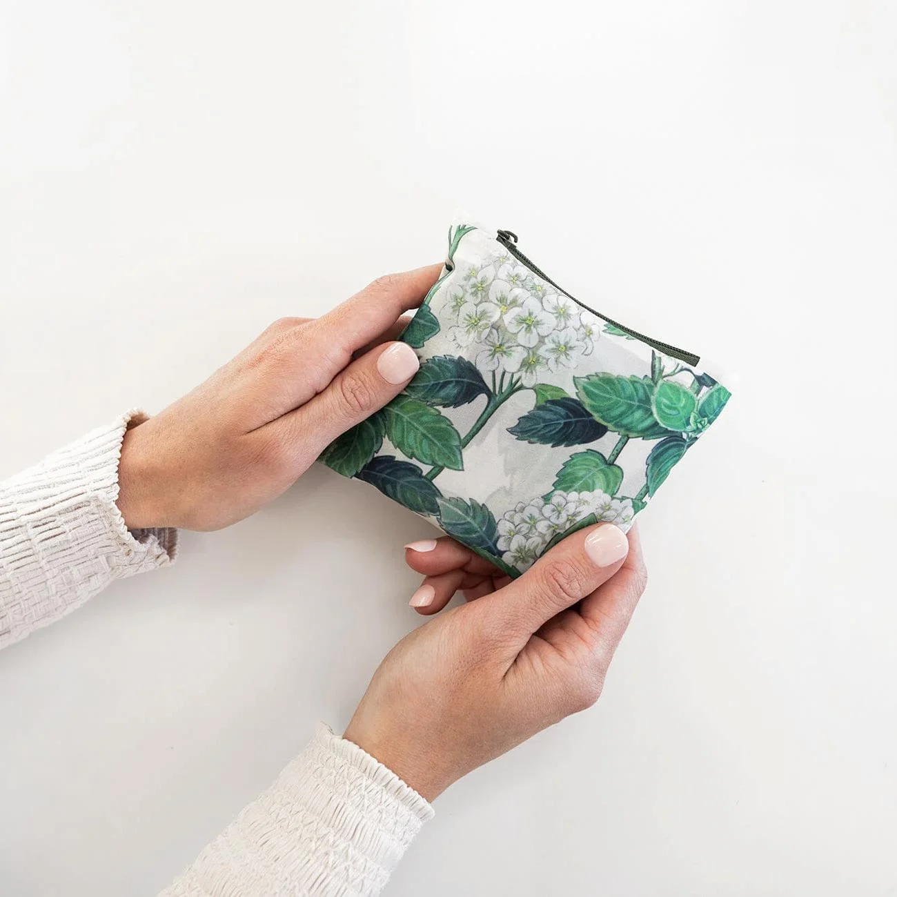hands holding reusable shopping bag