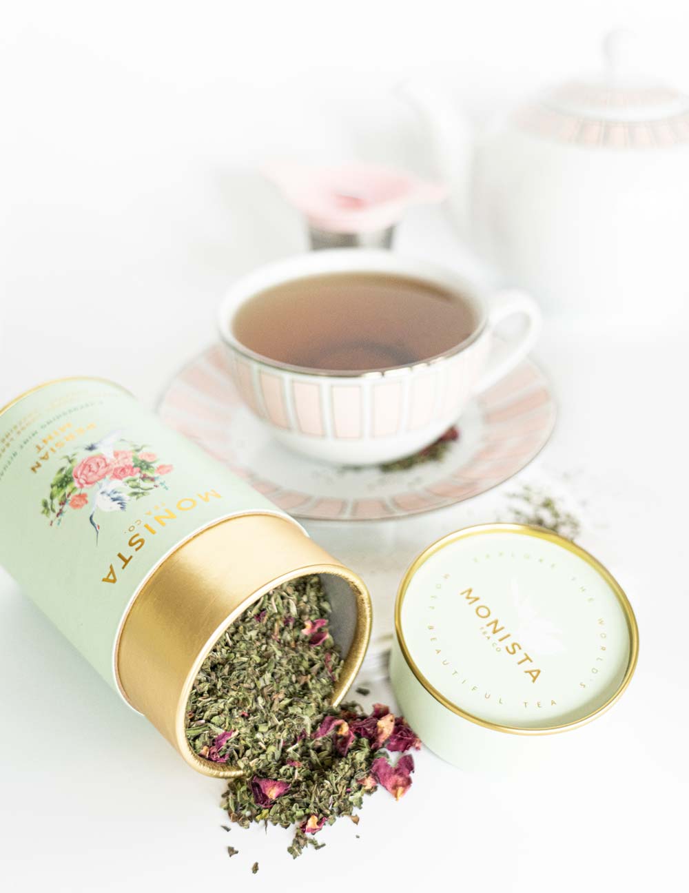 mint tea canister with cup of tea