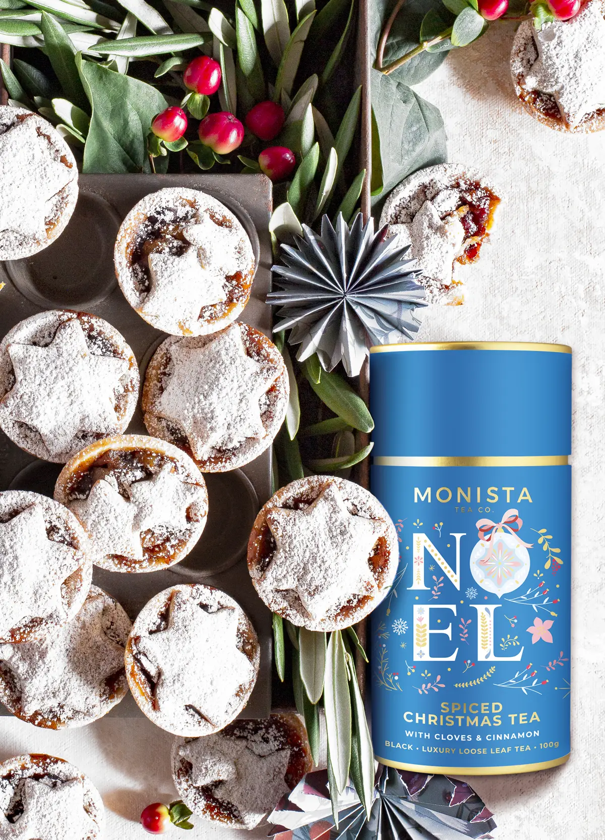 Mince pies with blue spiced christmas tea canister