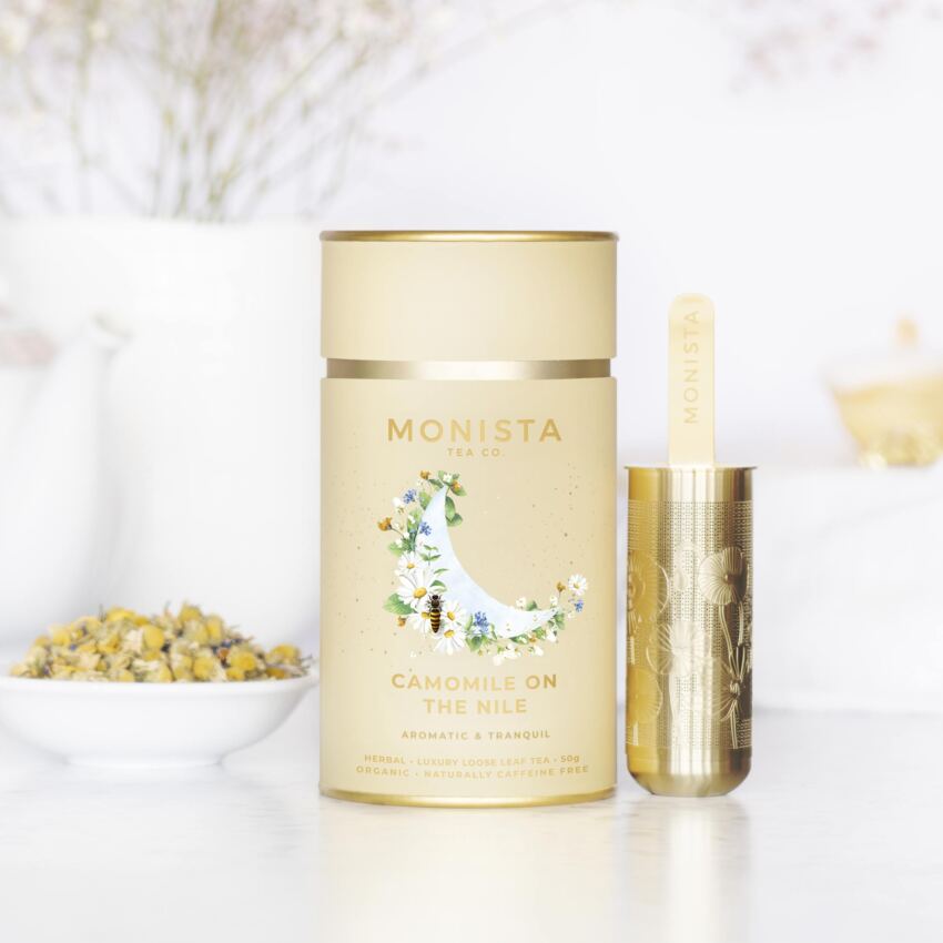Yellow tea canister with gold tea infuser