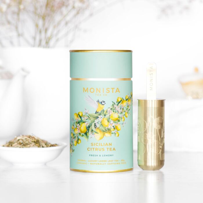 green tea canisters with lemons and a bird on it with gold tea infuser