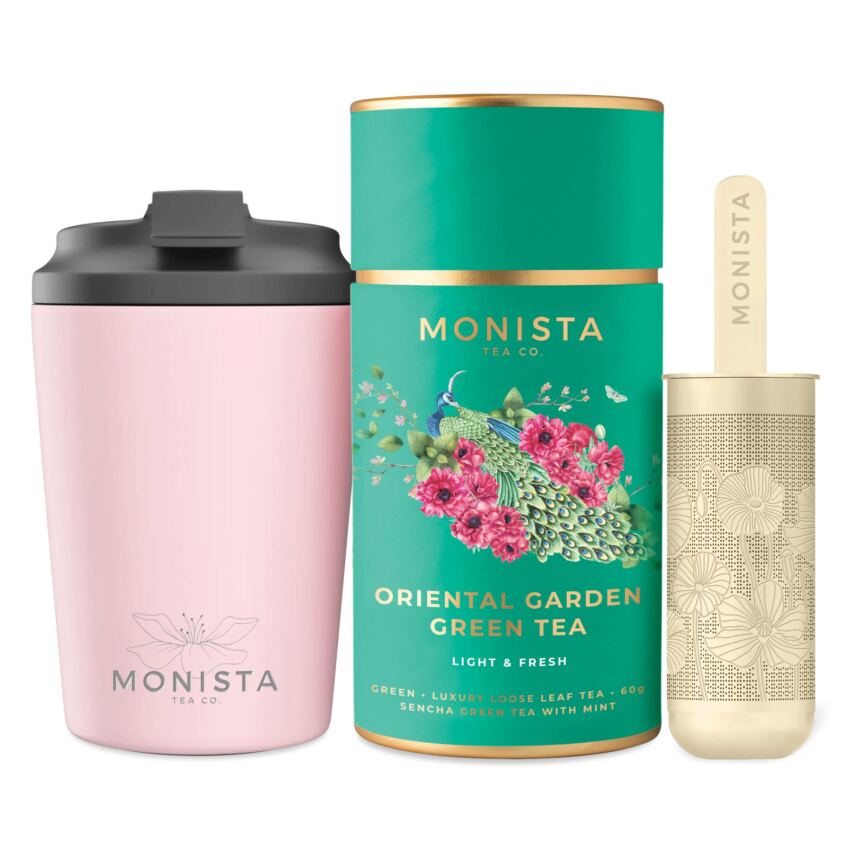 pink fressko cup with gold stick infuser and pretty tea canister